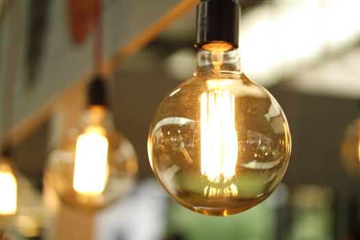 PRUGETTI A close-up of a glowing vintage Edison bulb creating a warm atmosphere.